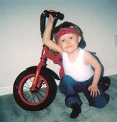 Little boy dressed as a greaser guy for Halloween.