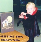 Baby wearing Dracula Halloween costume.