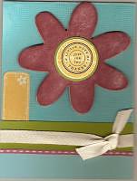 Chipboard flower used on a handmade card.