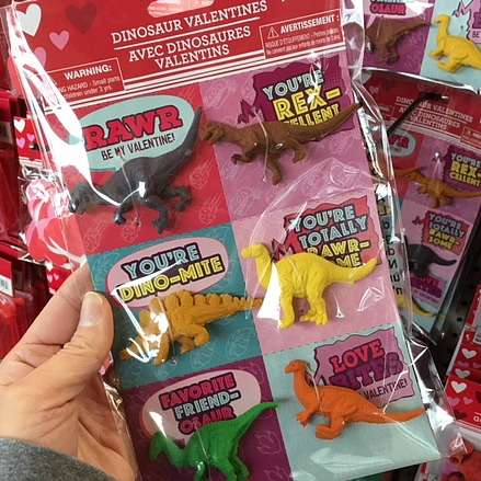 DIY Teachers Valentines Gifts - Each teacher gift basket includes one little dinosaur that's attached to a dinosaur-themed Valentine message from my son.