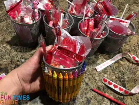 DIY crayon/pencil holder baskets with the Valentine candy inside.