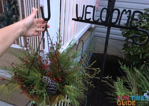 These DIY Christmas hanging baskets add life to the outside of your home for the holidays.