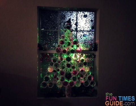 I placed Star Shower laser lights outside the window to give my PVC Christmas tree a colorful glow at night.