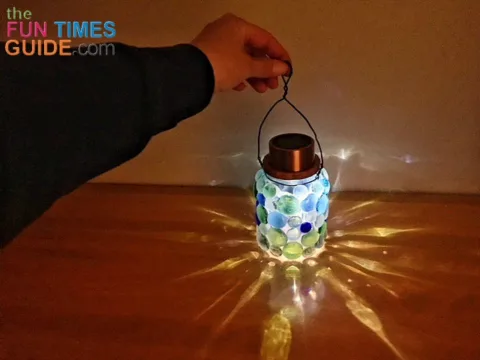 I really like the way the light is illuminated and displaced from the different colored gems on these DIY solar lanterns. 