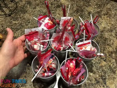 Wire mesh pencil holders filled with candy for DIY teacher Valentine gifts.